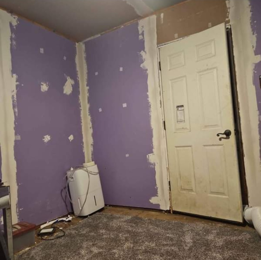 Cleanline drywall project with taped seams and patched wall surfaces