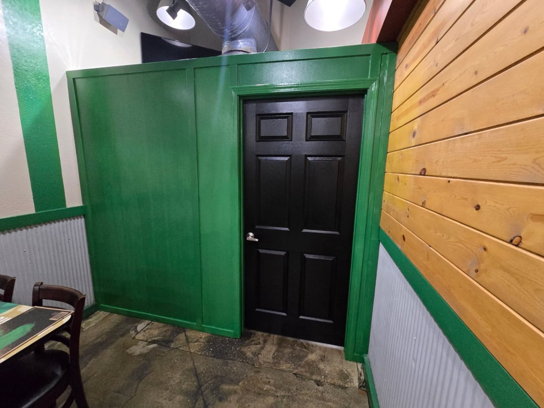 Cleanline project showing a black door and green painted trim